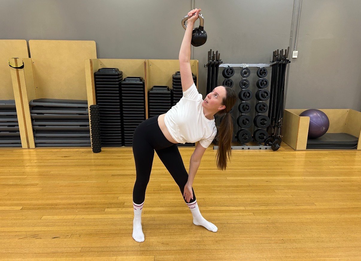 Katie Henderson personal trainer demonstrating a kettlebell exercise